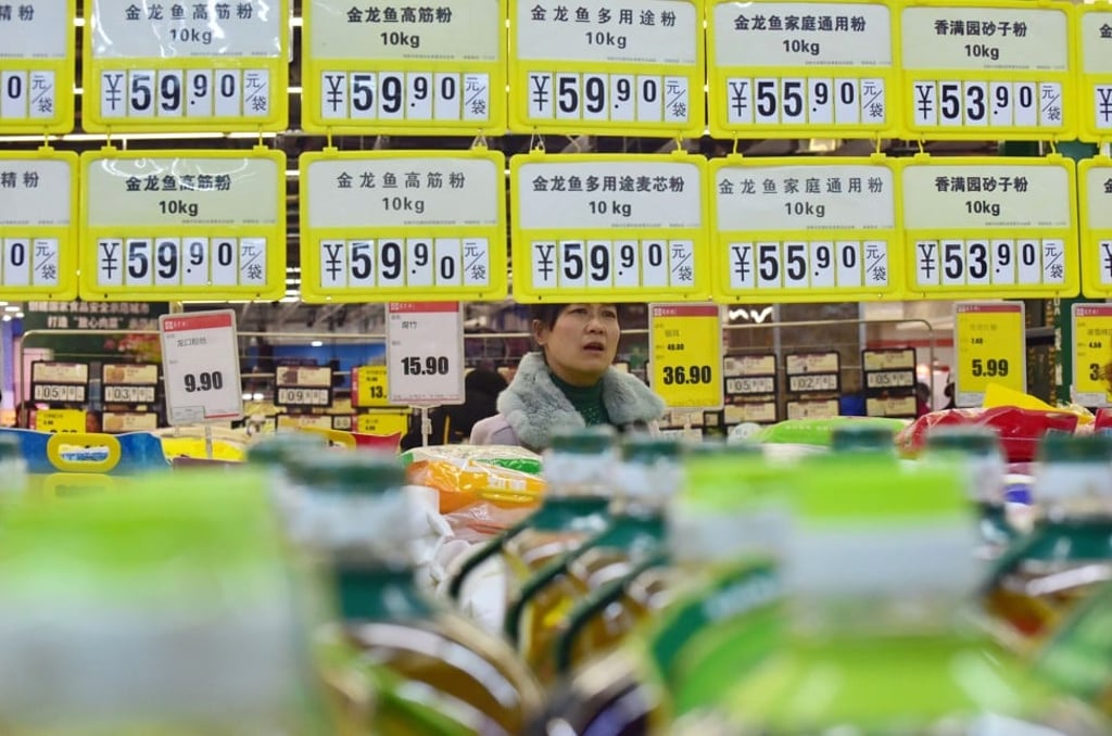 A customer shops at a supermarket in Handan, Hebei province. Photo: Reuters A customer shops at a supermarket in Handan, Hebei province. Photo: Reuters