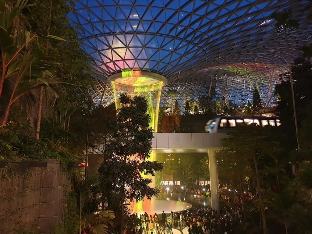 The waterfall at the HSBC Rain Vortex features music and light shows at night. Photo: Natasha Pack