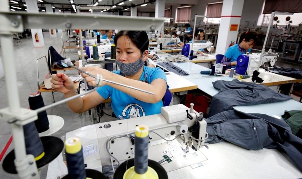 Labourers work at export garment Maxport factory in Hanoi, Vietnam. Photo: Reuters