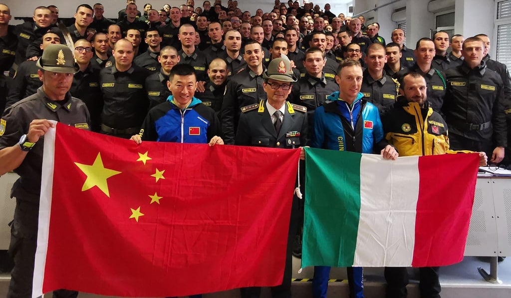 Andrea Gianni and Jin Yubo, China’s top elite skimo racer, with Italian troops during Chinese Mountaineering Association training with the Italian Army Alpine Military School in April. Photo: Handout