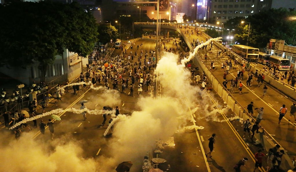 Police fire tear gas at protesters on Harcourt Road in Admiralty at the start of the Occupy protests. Photo: K.Y. Cheng