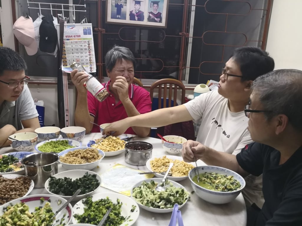 A family eating leicha at home. Photo: Thunder Tree