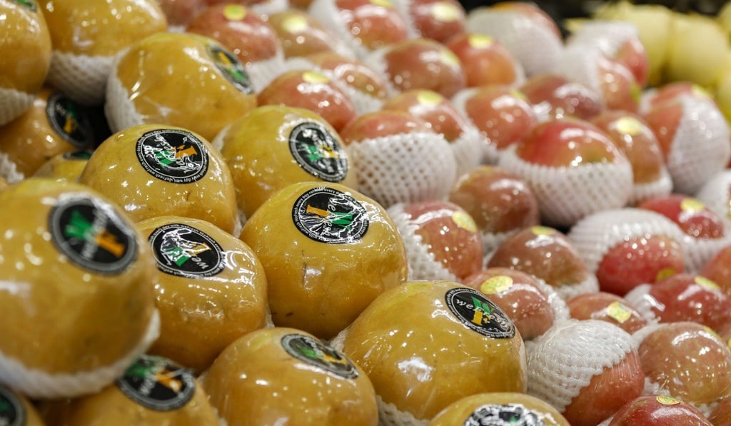 Fruits wrapped in cling film at a supermarket. Photo: Tory Ho