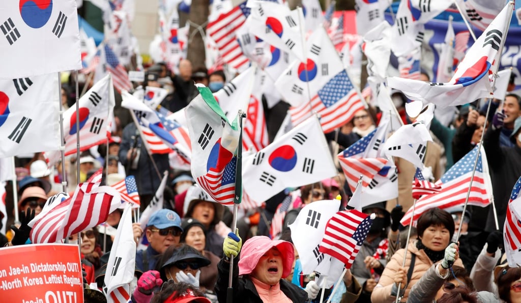 Supporters for ousted president Park Geun-hye react outside a Seoul court in 2018 after she was jailed. Photo: Reuters