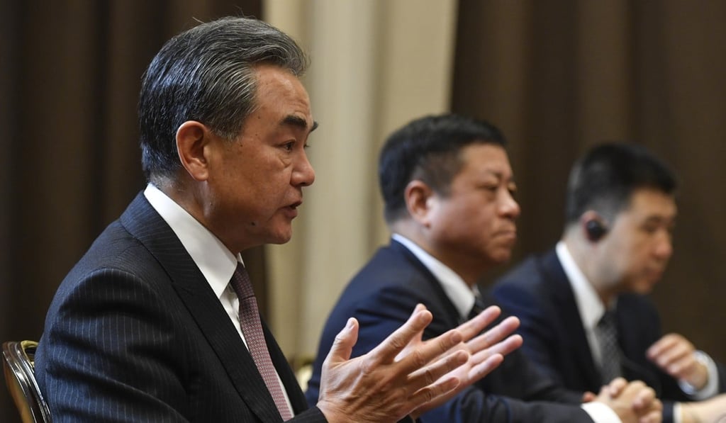 Chinese Foreign Minister Wang Yi (left) says China is willing to resolve its differences with the US through negotiations. Photo: AP