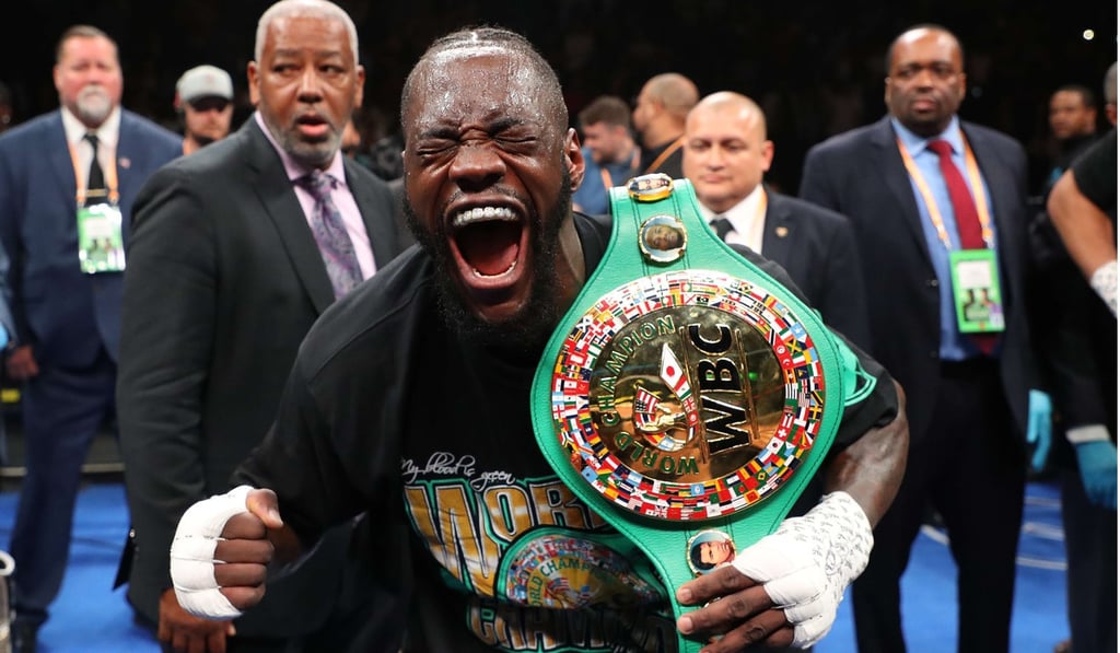 Deontay Wilder celebrates after knocking out Dominic Breazeale on Saturday night. Photo: AFP