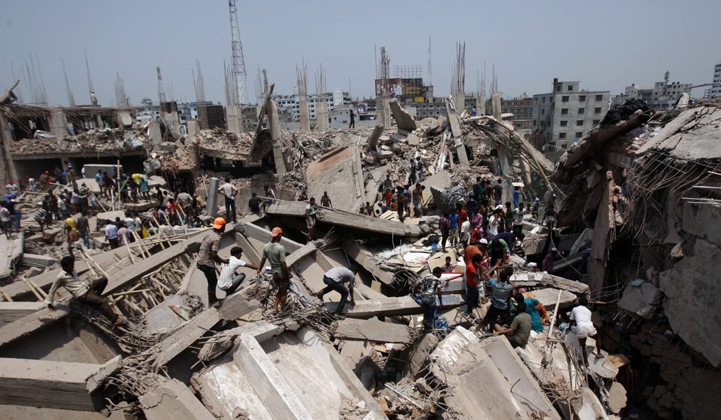 Civilians pick through the debris of the collapsed Rana Plaza. Photo: EPA