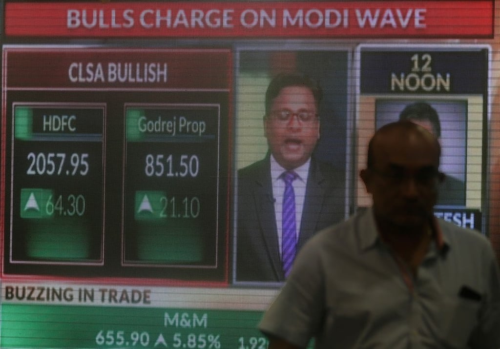 A screen displays news of markets updates in Mumbai. Photo: Reuters
