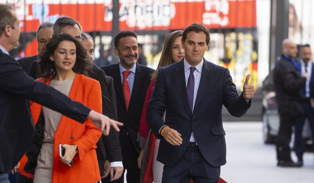 Albert Rivera, leader of Ciudadanos, right, gestures as he arrives to attend the opening sessions at The Congress of Deputies in Madrid. Photo: Bloomberg