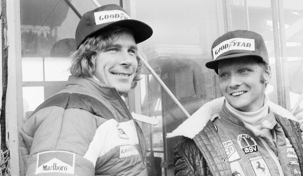 In this October 24, 1976 file photo, Niki Lauda (right) and James Hunt look at the rain before the start of the Japan Grand Prix at Fuji International Speedway in Gotemba. Photo: AP