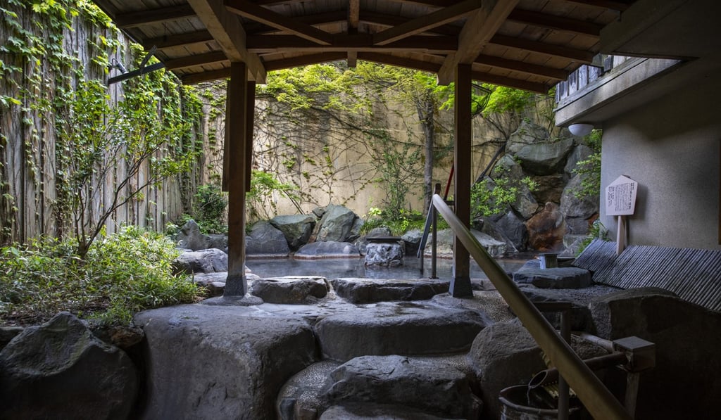 An outdoor hot springs bath at the Kagetsu inn in Yuzawa, Niigata prefecture, bought last year by a Hong Kong private equity fund. Photo: Bloomberg An outdoor hot springs bath at the Kagetsu inn in Yuzawa, Niigata prefecture, bought last year by a Hong Kong private equity fund. Photo: Bloomberg