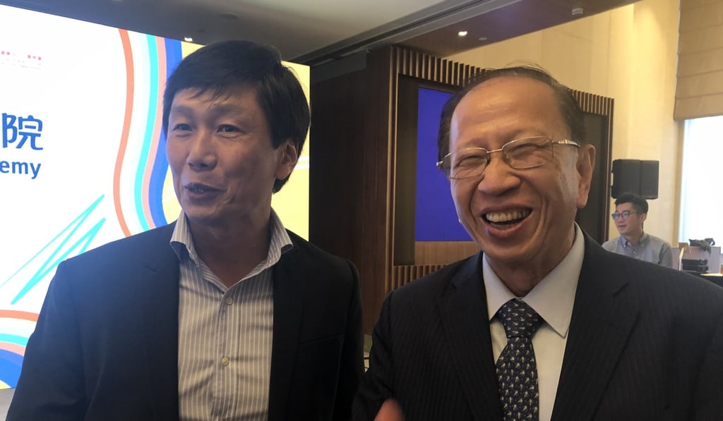 Pui Kwan-kay (right) and Sports Commissioner Yeung Tak-keung. Photo: Handout