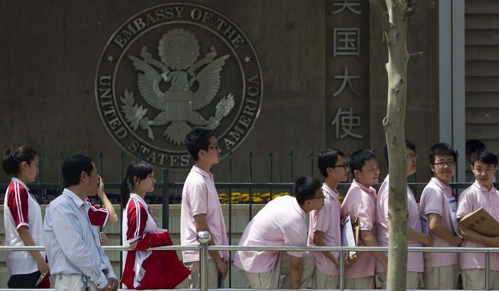 Chinese students wait outside the US Embassy in Beijing for visa application interviews. Photo: AP