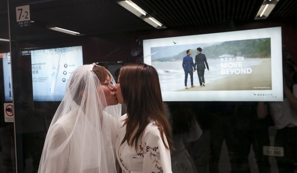 Cleo Lo (L) and Kitty Choi pose for picture at the Central MTR station on Saturday. Photo: Sam Tsang