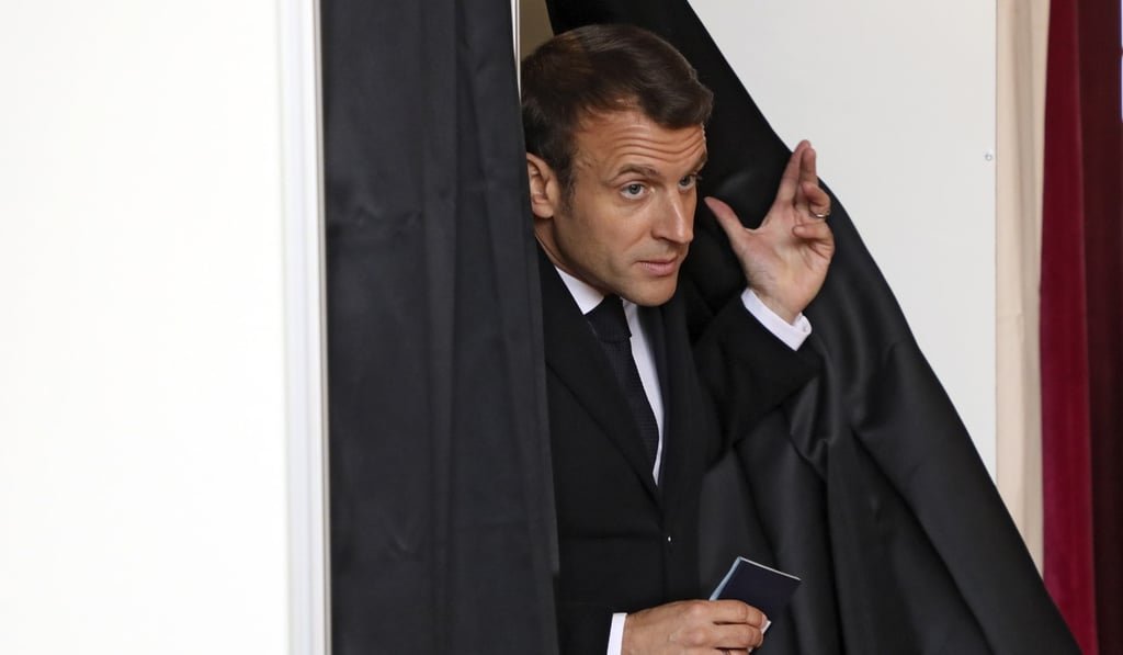 French President Emmanuel Macron leaves the polling booth in Le Touquet, France, on Sunday. Photo: EPA-EFE