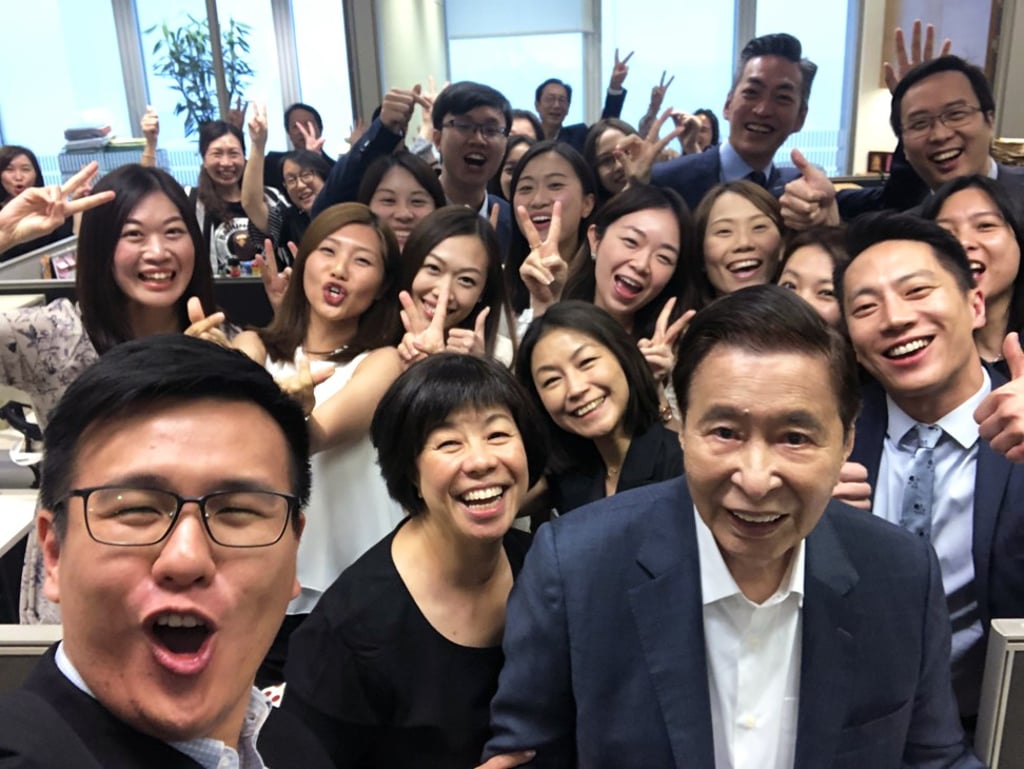 Lee Shau-kee with Henderson Land Development’s employees just before his retirement. Photo: Handout