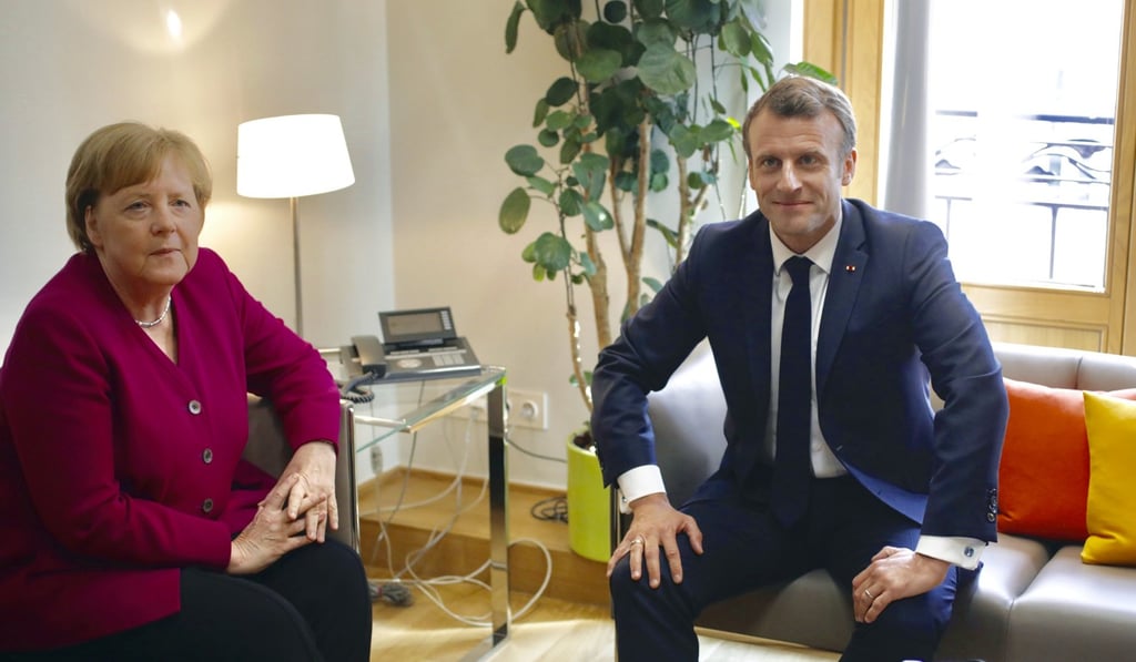 German Chancellor Angela Merkel meets French President Emmanuel Macron on the sidelines of the EU summit in Brussels on Tuesday. Photo: AP