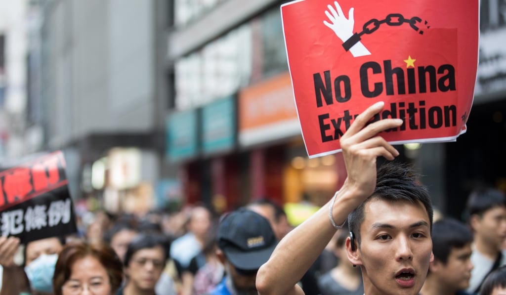 Pro-democracy activists take part in a march against a proposed extradition law in Hong Kong. Photo: EPA-EFE