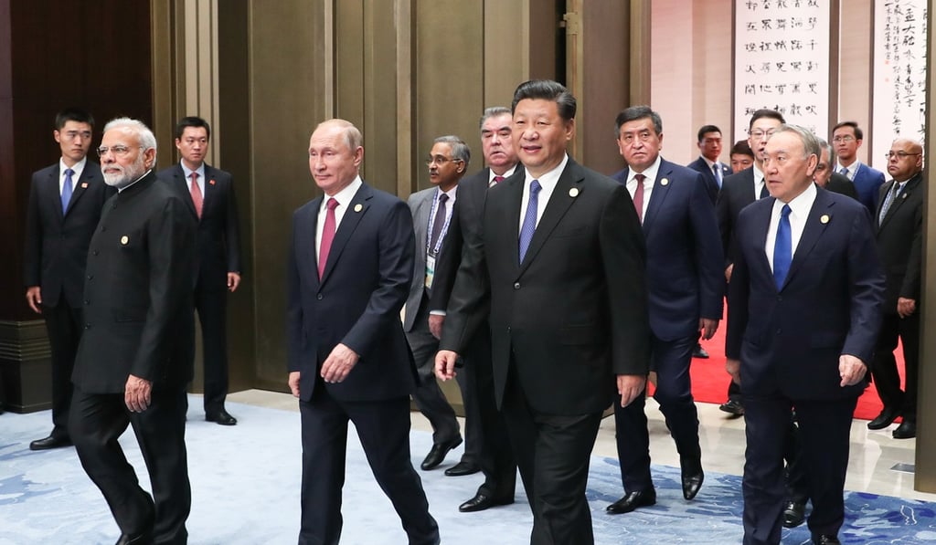 Indian Prime Minister Narendra Modi walks next to Russia’s leader Vladimir Putin and China’s President Xi Jinping at the 18th SCO summit in Qingdao last year. Photo: Xinhua