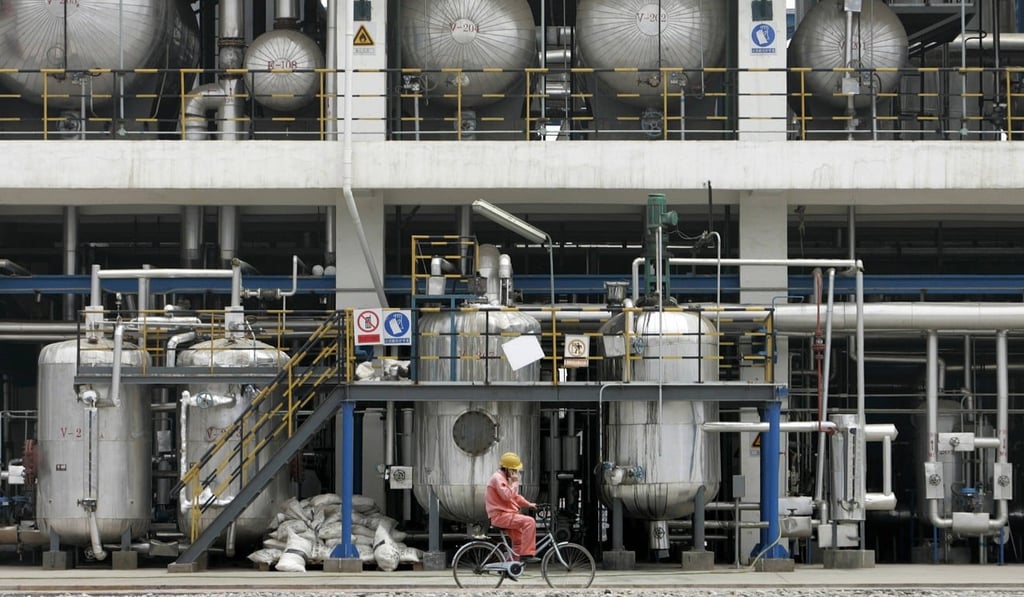A worker cycles inside China National Petroleum Corporation’s Lanzhou Chemical Industry Company. Photo: Reuters A worker cycles inside China National Petroleum Corporation’s Lanzhou Chemical Industry Company. Photo: Reuters