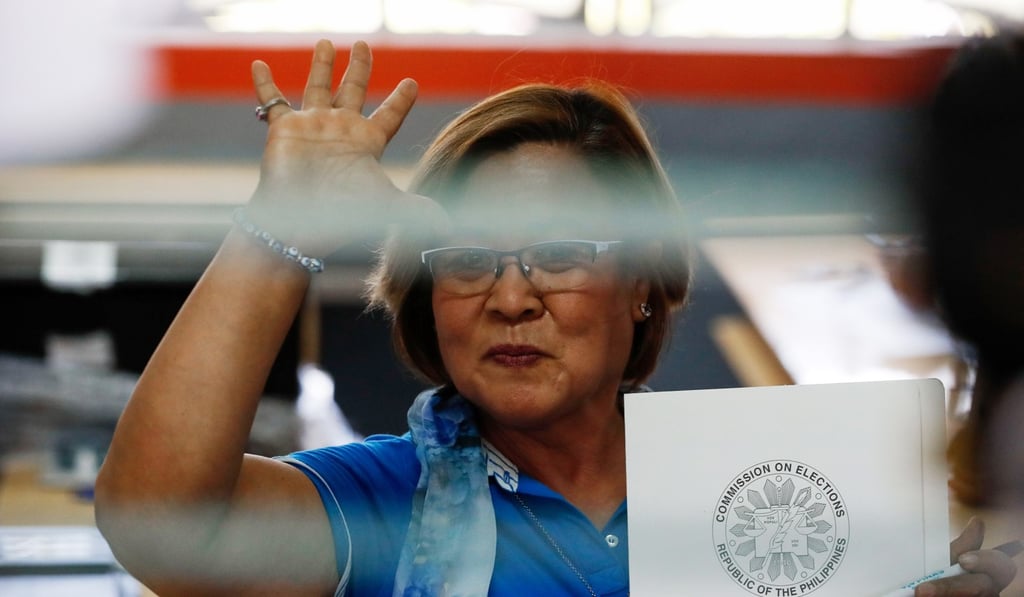 Detained Philippine Senator Leila De Lima gestures before casting her vote earlier this month. Photo: EPA
