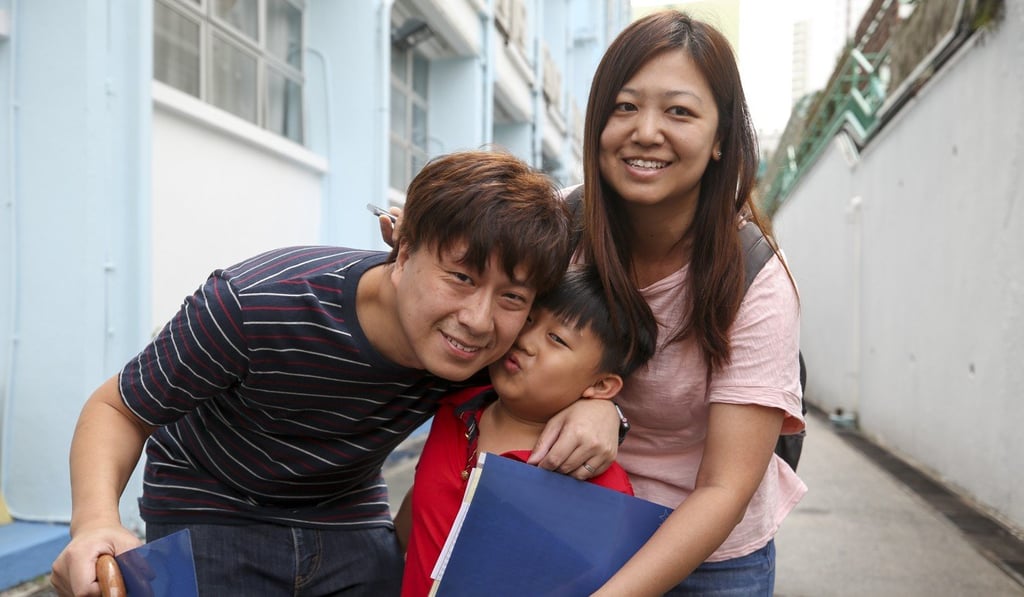 The Fongs and their son Tsz-yu are all smiles at CCC Kei Wa Primary School in Kowloon Tong. Photo: Winson Wong