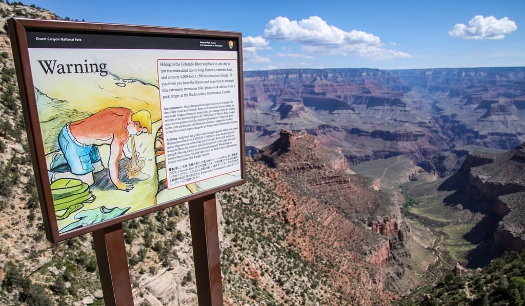 Posted signs warn tourists and hikers of the dangers of hiking in the Grand Canyon. Photo: AFP