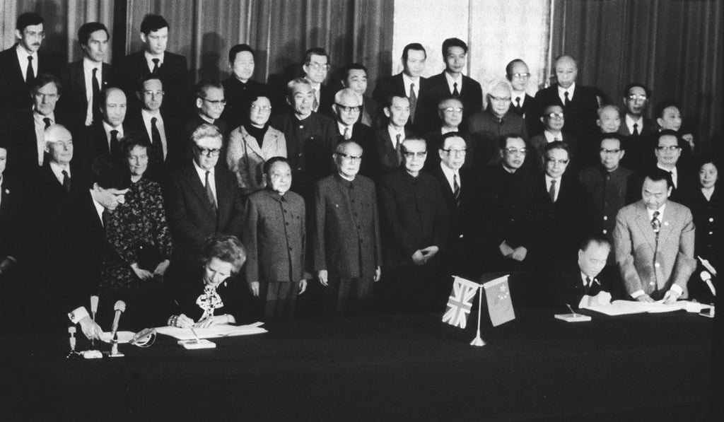 Then British prime minister Margaret Thatcher and then Chinese premier Zhao Ziyang sign the Sino-British Joint Declaration in 1984 while officials from both sides look on. Photo: SCMP