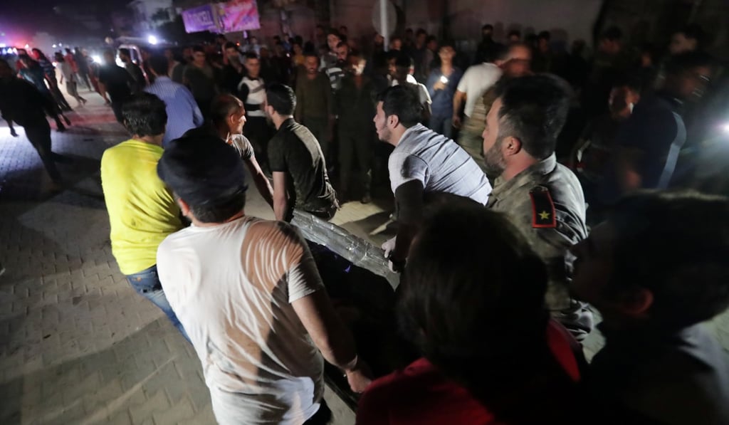 People carry a casualty away from site of a car bomb blast in Azaz. Photo: Reuters People carry a casualty away from site of a car bomb blast in Azaz. Photo: Reuters