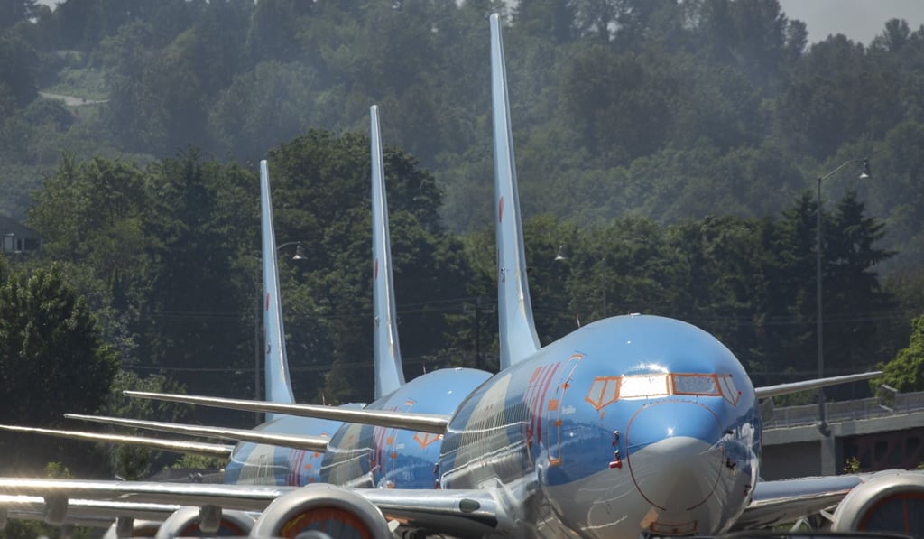 Boeing 737 MAX aeroplanes from TUI Airways sit parked in a parking lot at a Boeing facility. Photo: AFP Boeing 737 MAX aeroplanes from TUI Airways sit parked in a parking lot at a Boeing facility. Photo: AFP