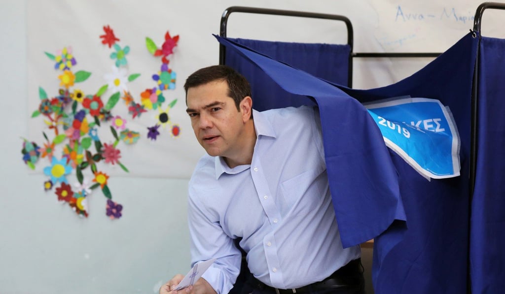 Greek Prime Minister Alexis Tsipras exits the polling booth. Photo: Reuters Greek Prime Minister Alexis Tsipras exits the polling booth. Photo: Reuters