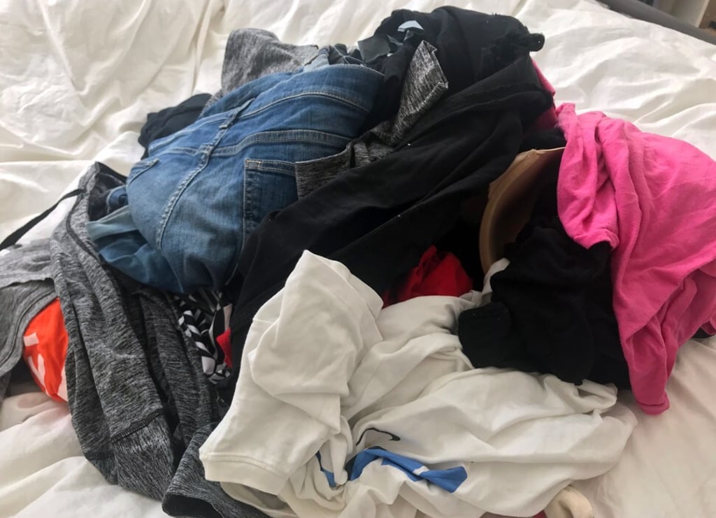 Clothes piled up and ready to be sorted according to Kondo's KonMari method. Photo: AFP