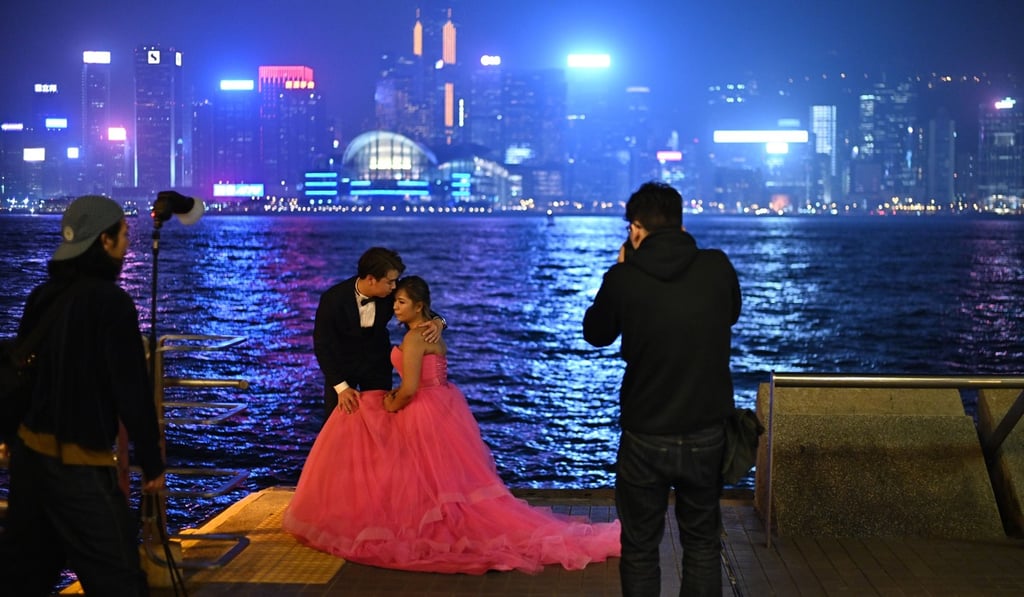 A couple pose for wedding photos in Hong Kong. For years now, Hong Kong women’s ideal number of children has been one or two, lower than in many other places in the world. Photo: AFP