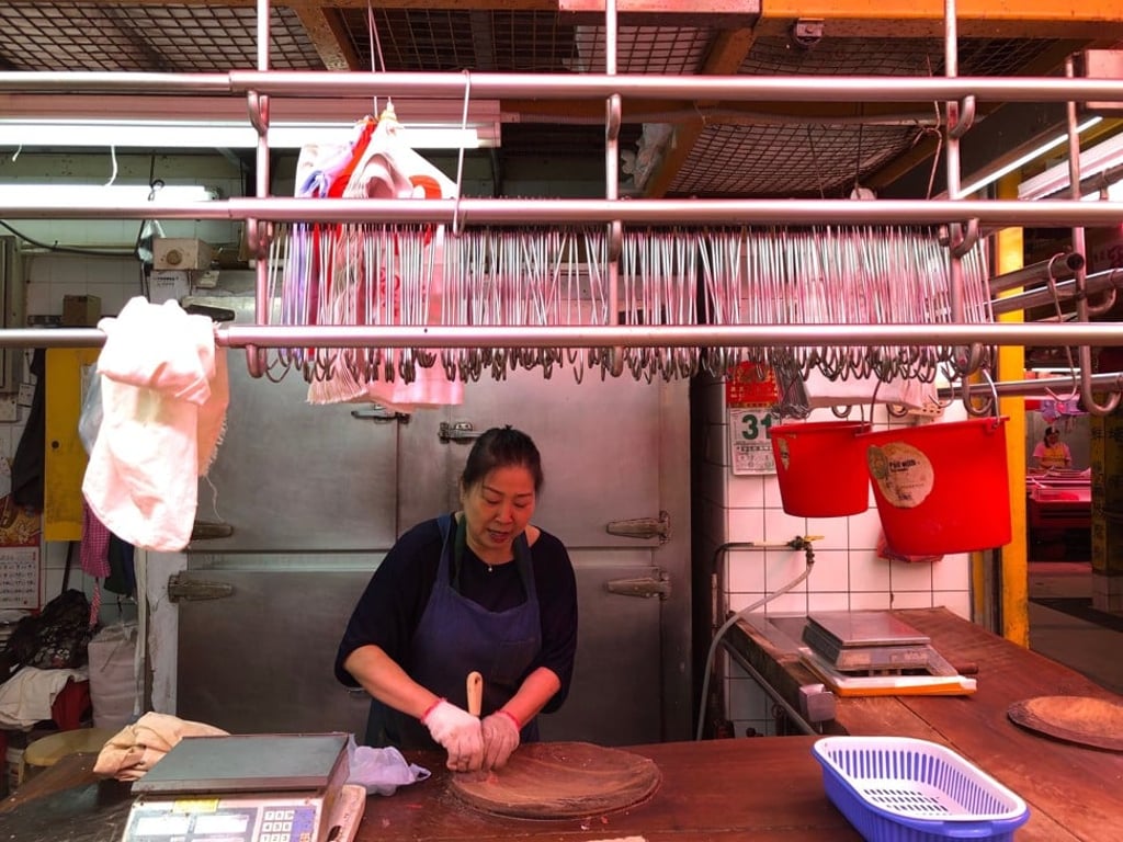 The owners of Pang Kee Butcher in Tai Po Hui Market are preparing to close until Tuesday after the latest outbreak of African swine fever. Photo: Denise Tsang