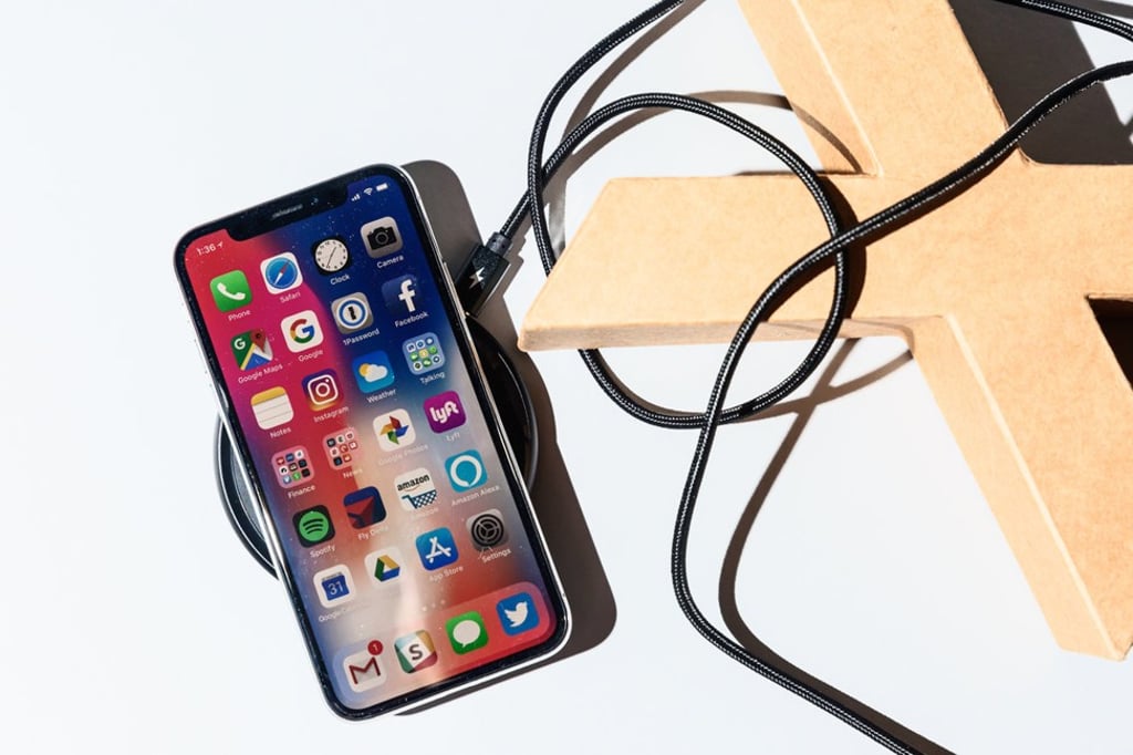 Just place your iPhone down on any Qi-certified charging pad, any it will immediately start charging. Photo: Business Insider Just place your iPhone down on any Qi-certified charging pad, any it will immediately start charging. Photo: Business Insider