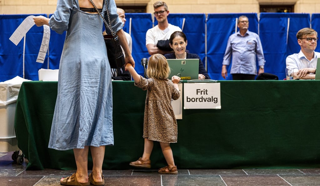 People cast their votes during the parliamentary elections shortly before the polling station closes at Copenhagen City Hall on Wednesday. Photo: EPA-EFE
