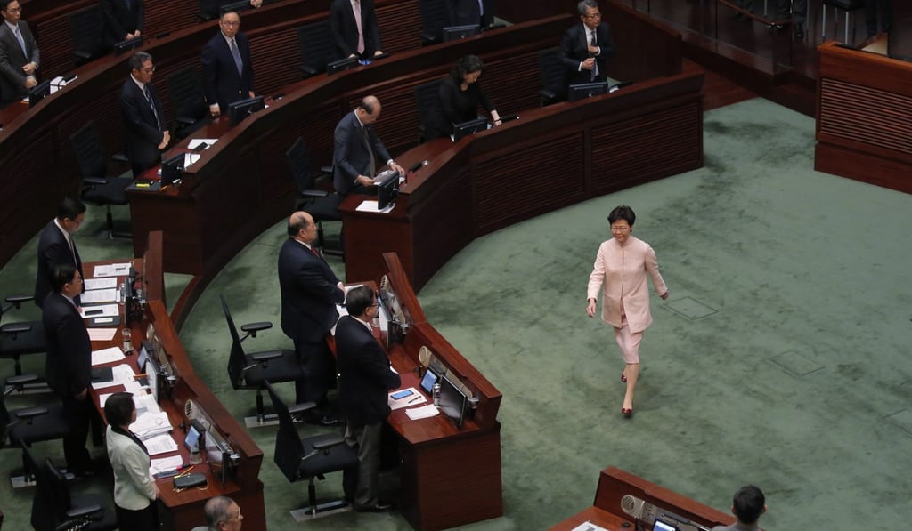 Chief Executive Carrie Lam leaves a meeting at the Legislative Council on May 22. Pro-democracy lawmakers have expressed their concerns about the new controversial law that would allow the extradition of suspected criminals to jurisdictions including mainland China. Photo: AP