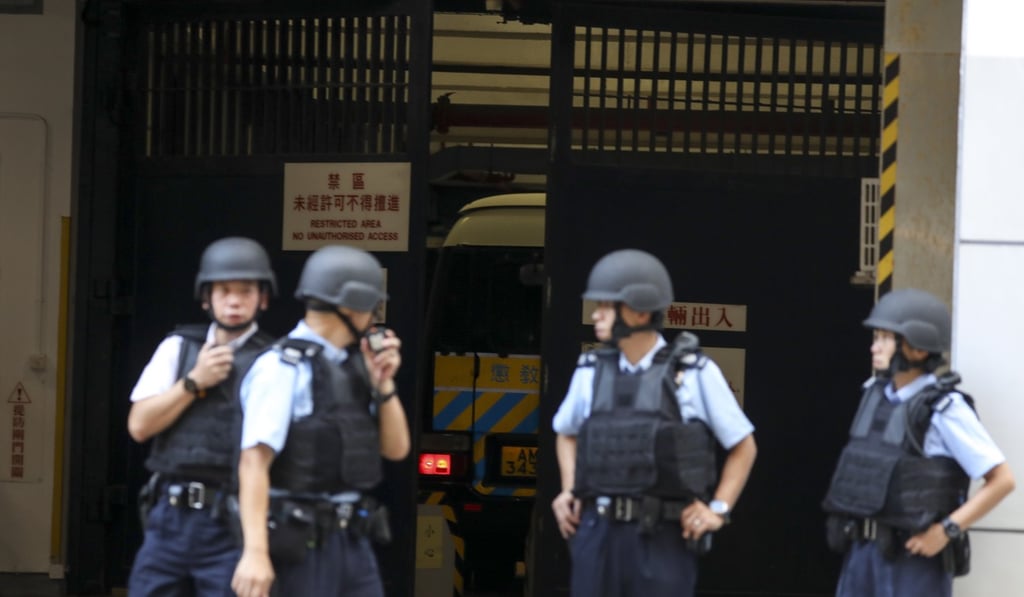 Police officers secure the area around the Eastern Court in Sai Wan Ho ahead of Ramanjit Singh’s arrival at court on Wednesday. Photo: Nora Tam