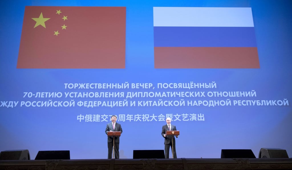 Xi Jinping and Vladimir Putin at a gathering to mark the 70th anniversary of diplomatic relations in Moscow on Thursday. Photo: Xinhua Xi Jinping and Vladimir Putin at a gathering to mark the 70th anniversary of diplomatic relations in Moscow on Thursday. Photo: Xinhua