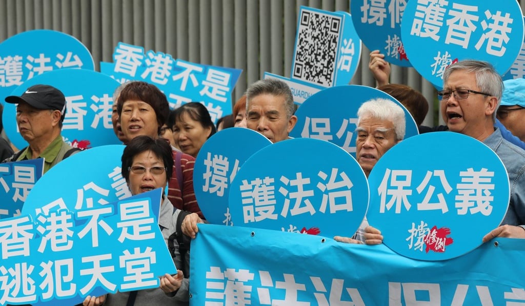 Supporters of the government’s extradition amendment demonstrate outside the Legislative Council during a meeting on the issue on April 17. Photo: Dickson Lee