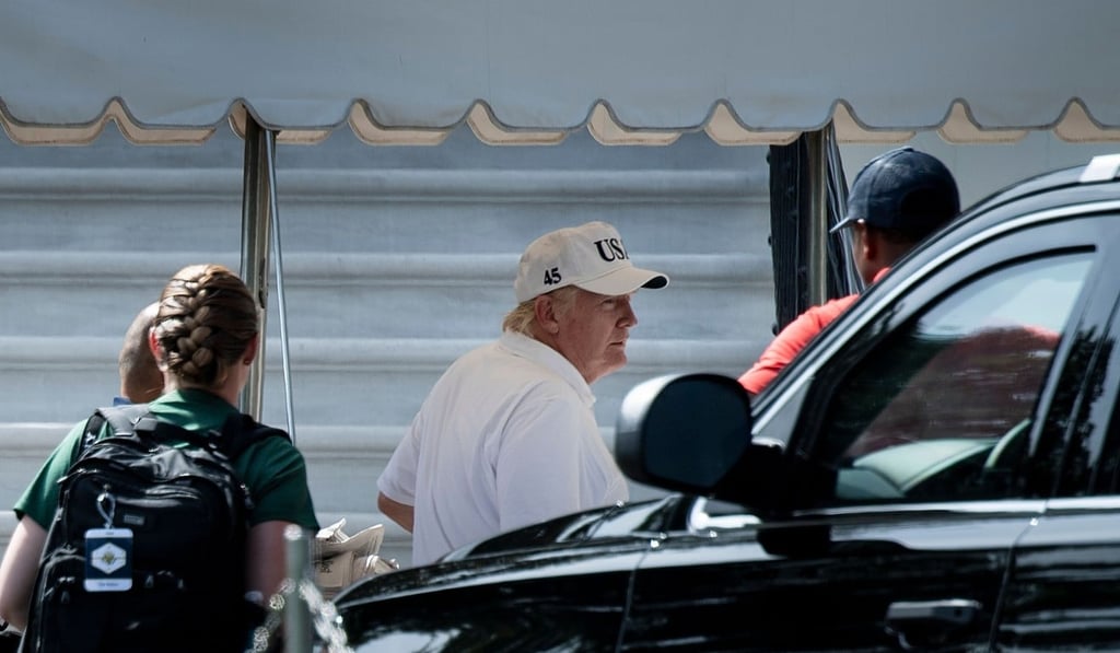 US President Donald Trump arrives at the White House after playing golf. Photo: AFP US President Donald Trump arrives at the White House after playing golf. Photo: AFP