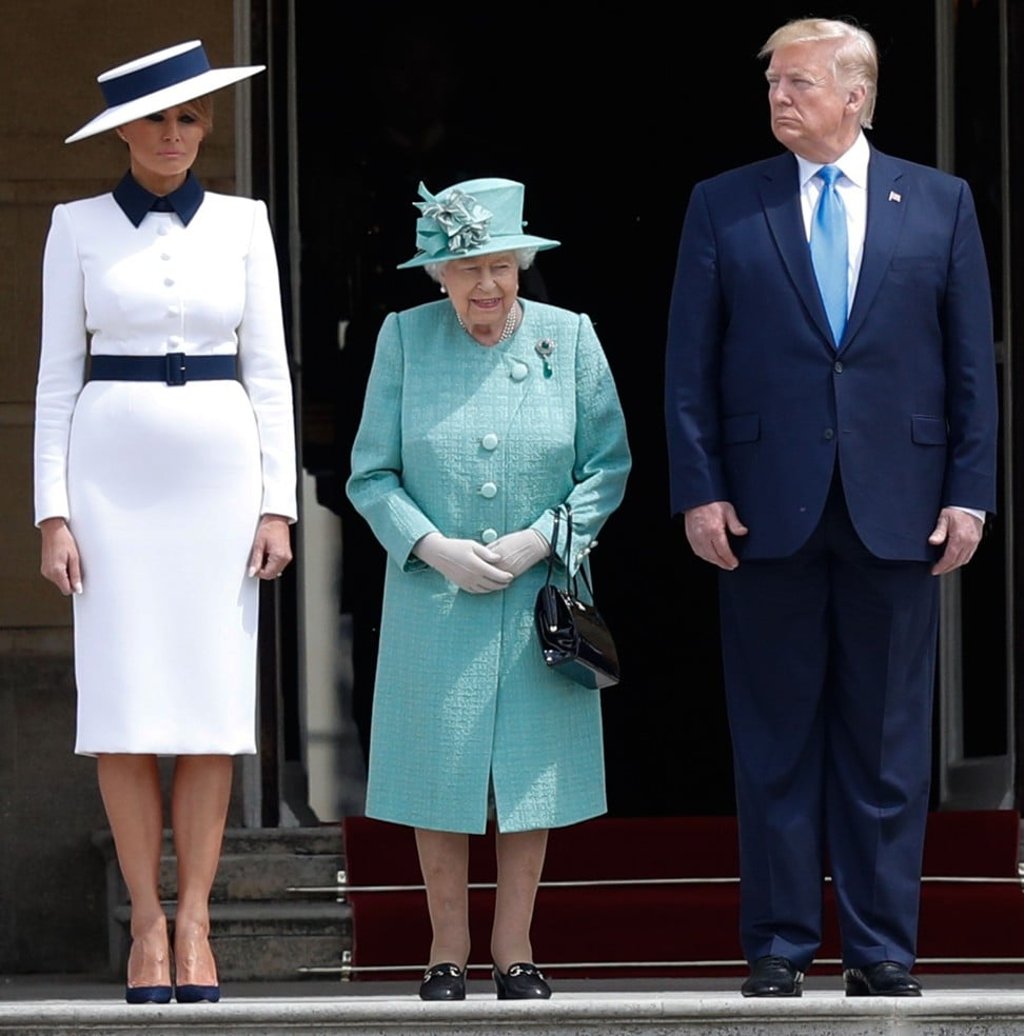 Queen Elizabeth (centre) is flanked by Melania and Donald Trump during a welcome ceremony at Buckingham Palace. Photo: AFP Queen Elizabeth (centre) is flanked by Melania and Donald Trump during a welcome ceremony at Buckingham Palace. Photo: AFP