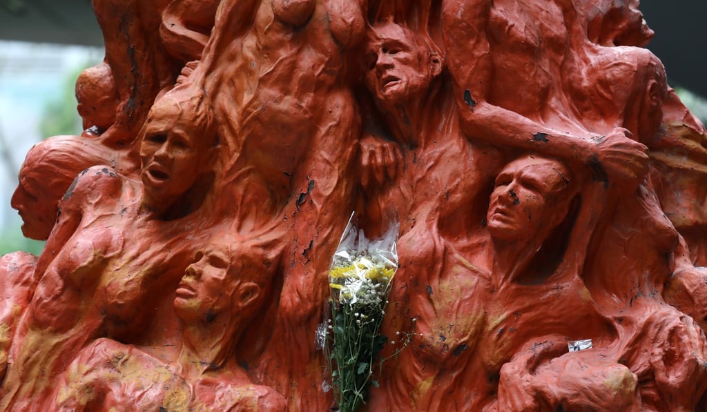 Flowers are laid at the Pillar of Shame at the University of Hong Kong in Pok Fu Lam to commemorate the 30th anniversary of the Tiananmen Square crackdown in 1989. Photo: Nora Tam