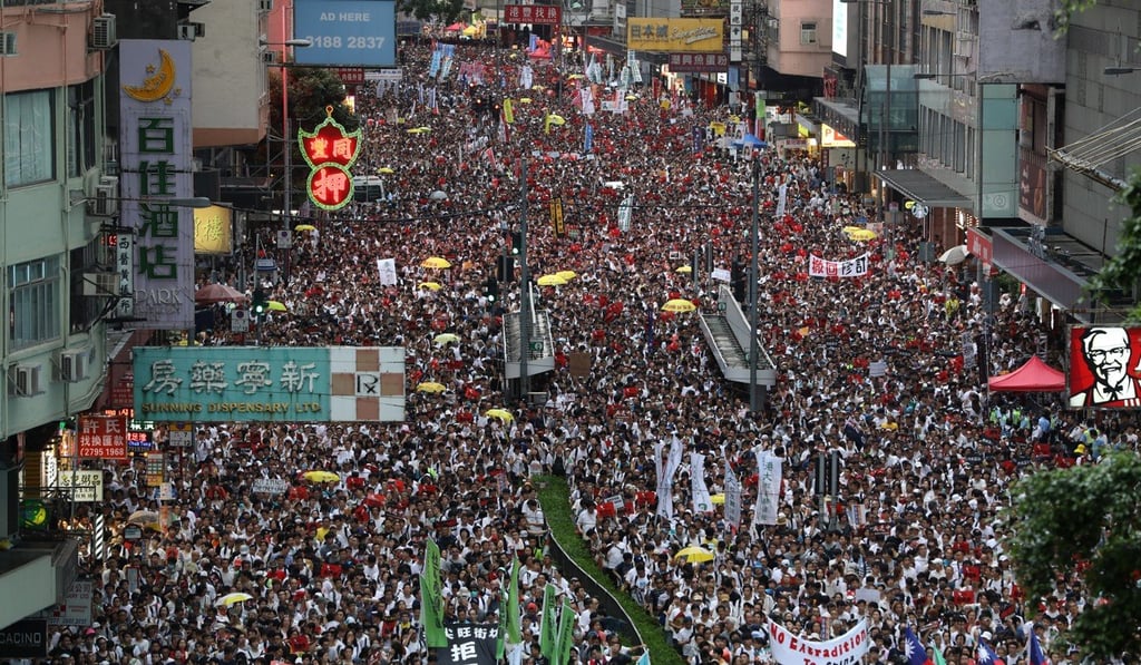 Hundreds of thousands march against the proposed legal changes on Sunday. Photo: Sam Tsang Hundreds of thousands march against the proposed legal changes on Sunday. Photo: Sam Tsang