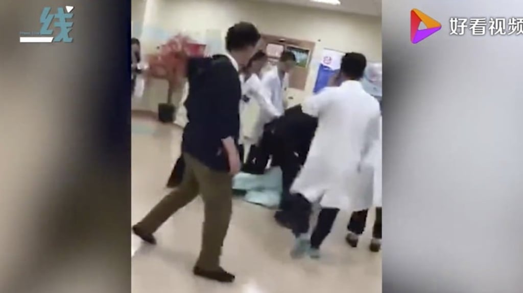 Zhao Xiaojing was handcuffed and taken away by police. Photo: Weibo