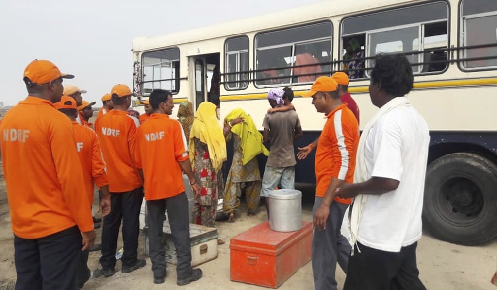 National Disaster Response Force personnel help villagers to evacuate from Naliya in the western state of Gujarat. Photo: AP National Disaster Response Force personnel help villagers to evacuate from Naliya in the western state of Gujarat. Photo: AP