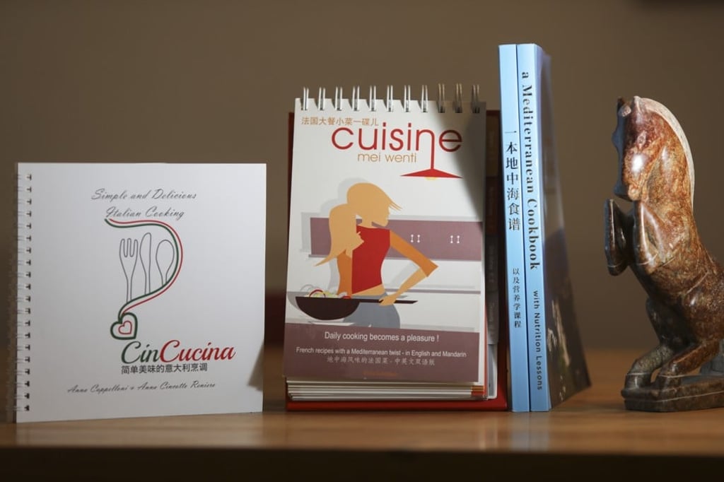 Cuisine Mei Wenti (centre) with other expat-written bilingual recipe books for Chinese readers: CinCucina, which covers Italian cuisine, and A Mediterranean Cookbook. Photo: Simon Song