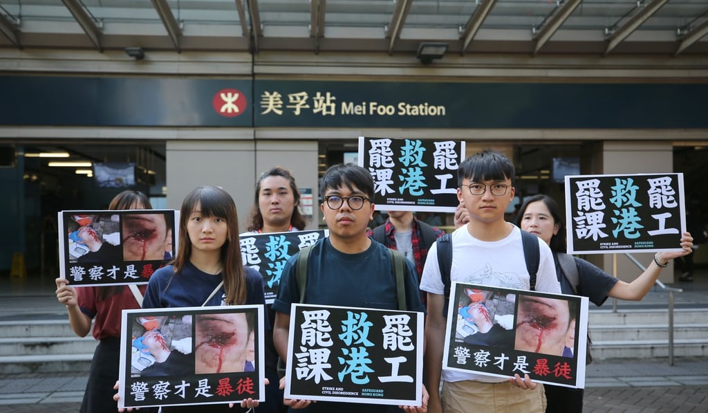 Members of pro-democracy party Demosisto protest outside Mei Foo station. Photo: Winson Wong