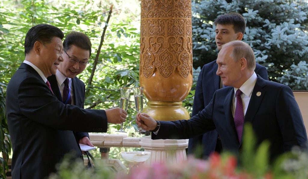 Xi and Putin toast their nation’s strong ties with champagne in Tajikistan. Photo: AFP