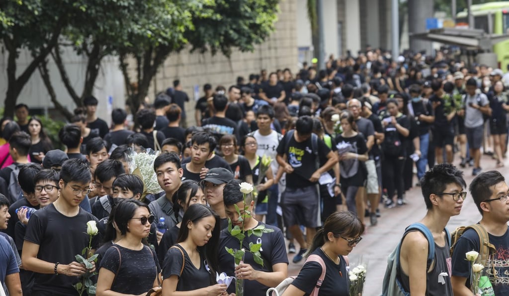 Protesters march past Pacific Place in Admiralty on their way to the government offices in Tamar. Photo: Dickson Lee Protesters march past Pacific Place in Admiralty on their way to the government offices in Tamar. Photo: Dickson Lee